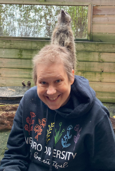 Excuse me, Madam, the eappears to be a meerkat on your head. 