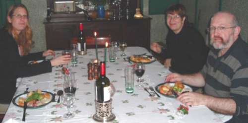 Heather, Sylvia and John sitting at the table for Xmas lunch