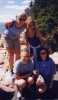 the girls pose by the lighthouse