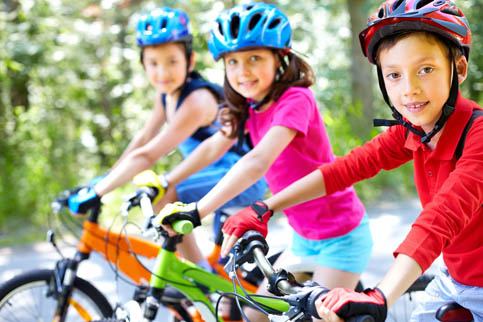 three children on bicycles